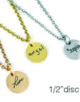 Three necklaces with engraved disc pendants: gold 'angel', silver 'Sophia', and rose gold 'Love'.