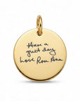 A round gold pendant charm engraved with the handwritten quote 'Have a great day love Rose Ann' on a clean white background.