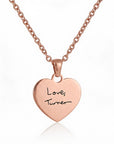 Rose gold heart-shaped pendant with 'Love Turner' engraving on a white background