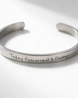 A polished silver cuff bracelet engraved with the handwritten phrase 'Today tomorrow & Always' on a clean white background.