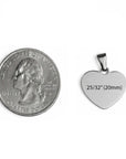 Heart-shaped pendant next to a quarter for size comparison on a white background
