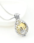 Close Up of Gold Floral Urn Locket with Butterflies