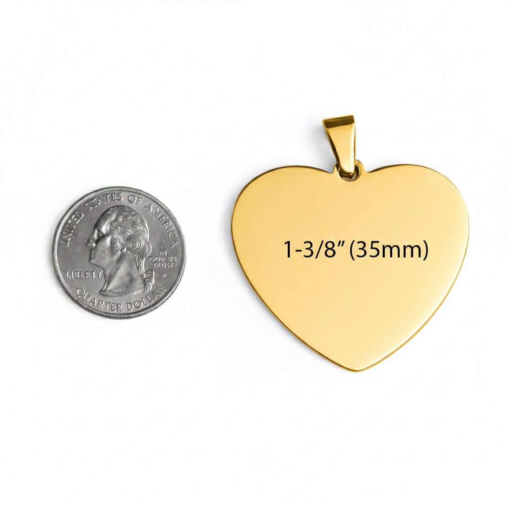 Gold heart-shaped pendant with measurement text next to a quarter for scale on a white background