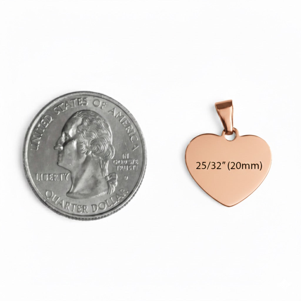 Rose gold heart-shaped pendant next to a quarter for size comparison on a white background