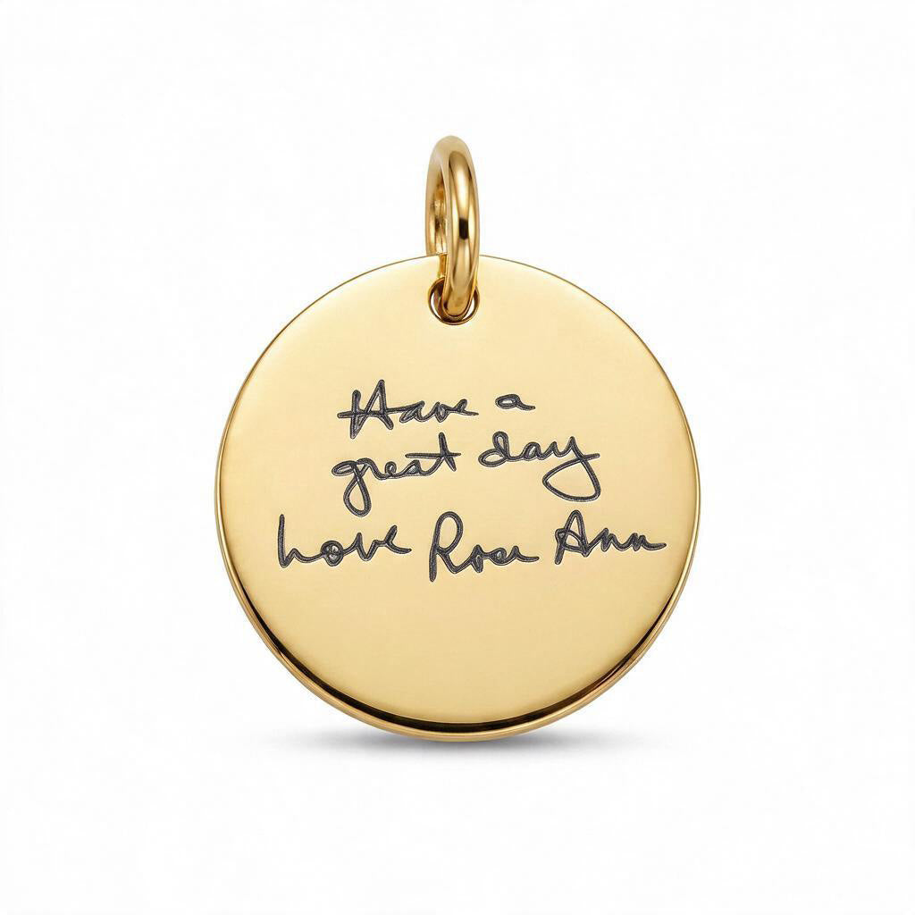 A round gold pendant charm engraved with the handwritten quote 'Have a great day love Rose Ann' on a clean white background.
