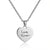 Silver heart-shaped pendant necklace with 'Love Turner' engraving on a white background